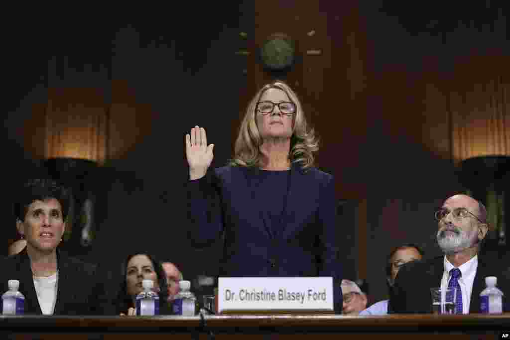 Christine Blasey Ford is sworn in before the Senate Judiciary Committee, in Washington. Dr. Ford, who accused Supreme Court nominee Brett Kavanaugh of sexually assaulting her decades ago, provided detailed and emotional testimony before the panel.