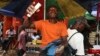 A 'dollar boy' sells dollars, pounds and euros on the streets of Sierra Leone's capital, a country facing endemic government graft charges.