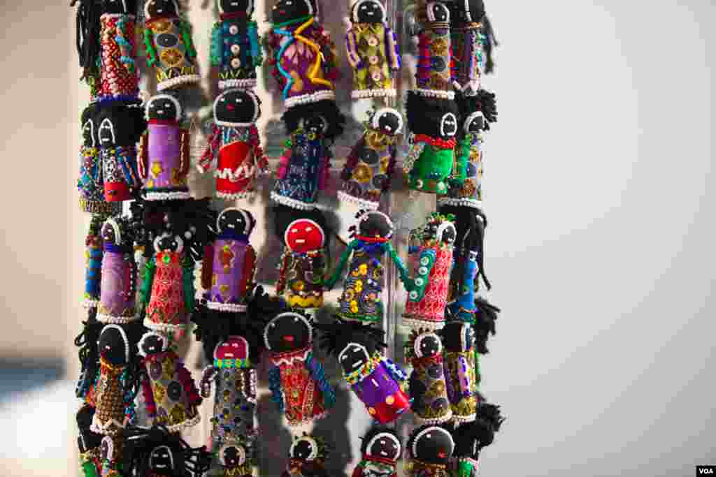 The Orphan Tower, a tower of small beaded cloth dolls, is set up at the AIDS conference. The tower signifies the number of young children orphaned by AIDS in South Africa -- the current number is 3.7 million. (Alison Klein/VOA) 