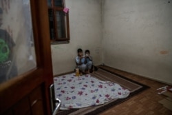 Two families, 12 people total, live in this unfurnished apartment in Van, Turkey, after fleeing Afghanistan, Aug. 10, 2021. (Claire Thomas/VOA)
