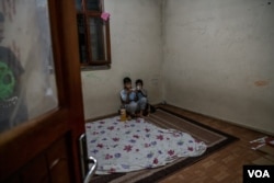 Two families, 12 people total, live in this unfurnished apartment in Van, Turkey, after fleeing Afghanistan, Aug. 10, 2021. (Claire Thomas/VOA)