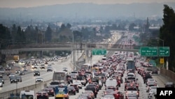 (FILES) Traffic on a Los Angeles freeway during the evening rush hour commute on April 12, 2023 in Alhambra, California.