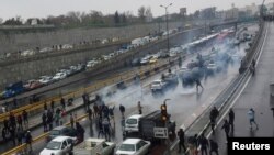  In this Nov. 16, 2019 file photo, protestors block a road after authorities raised gasoline prices, in Tehran, Iran.