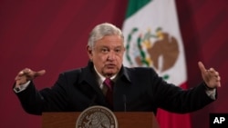FILE - Mexican President Andres Manuel Lopez Obrador gives his daily morning news conference at the presidential palace, in Mexico City, Dec. 18, 2020.