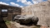 FILE - This 6-meter-high bronze statue of Josef Stalin, the Soviet dictator, was removed from the central square of Gori, Georgia, his birthplace. This week, a bust of Stalin was removed for violating a ban on "public display of symbols of totalitarianism." 