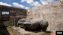 FILE - This 6-meter-high bronze statue of Josef Stalin, the Soviet dictator, was removed from the central square of Gori, Georgia, his birthplace. This week, a bust of Stalin was removed for violating a ban on "public display of symbols of totalitarianism." 