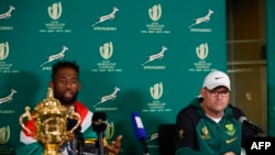 Springboks captain Siya Kolisi speaks next to his head coach Jacques Nienaber during a press conference after the team arrived at the OR Tambo International airport from France, on October 31, 2023.