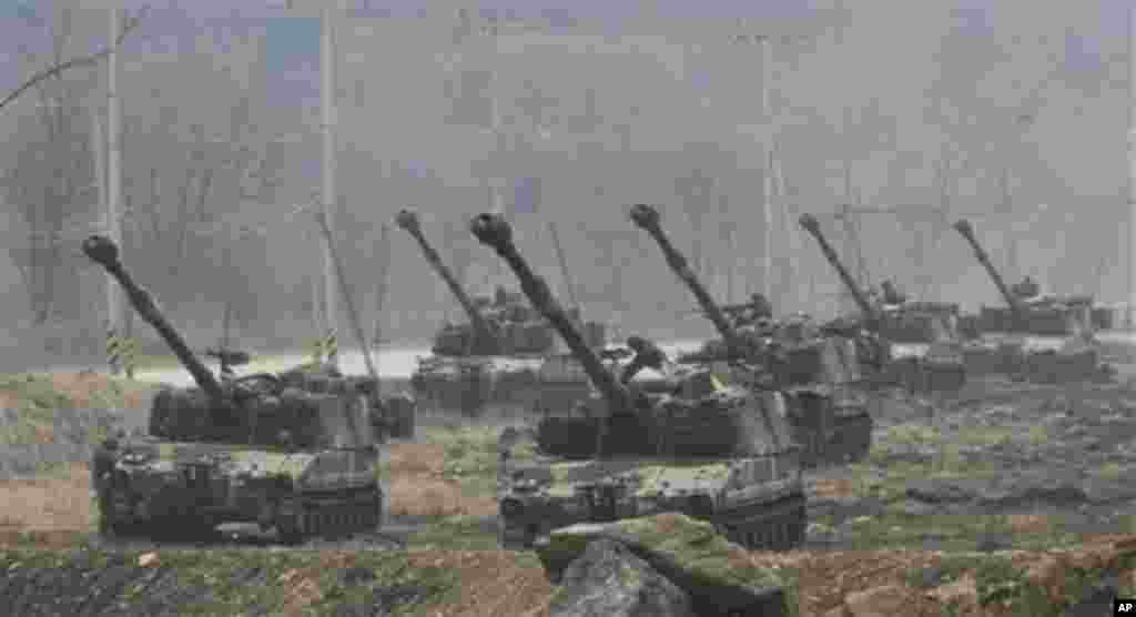 South Korean K-55 self-propelled howitzers are deployed during a military exercise near the border village of Panmunjom, the demilitarized zone which has separated the two Koreas since the Korean War in Paju, South Korea, Friday, April 13, 2012. North Kor