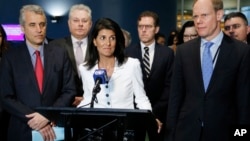 Surrounded by other supporting countries, United States Ambassador to the United Nations Nikki Haley (center) speaks to reporters outside the General Assembly at U.N. headquarters, March 27, 2017. Haley and the other representatives were not participating in a meeting about prohibiting nuclear weapons, saying it was not the right time to do so in consideration of other countries that are trying to develop the weapons. 