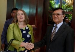 Leader of the Cambodia National Rescue Party (CNRP) Kem Sokha shakes hands with British Ambassador to Cambodia Tina Redshaw at his home in Phnom Penh, Cambodia, November 14, 2019.