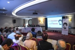 FILE - Lawyers for jailed philanthropist Osman Kavala hold a press conference in Istanbul, Turkey, Oct. 31, 2018.