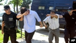 Turkish military personnel who were aboard a Blackhawk military helicopter are transferred to a prosecutor's office in the city of Alexandroupolis, northern Greece, July 17, 2016. 