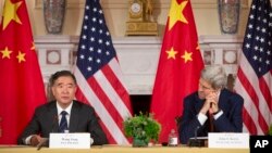 Secretary of State John Kerry, right, listens to China's Vice Premier Wang Yang, left, speak during the US China Closing Statements at US China Strategic and Economic Dialogue (S&ED) at the US State Department in Washington, Wednesday, June 24, 2015.