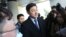 Oh Seung-hun, center, speaks to the media after a court's verdict to overturn his conviction on refusing to perform mandatory military service, at the Supreme Court in Seoul, South Korea, Nov. 1, 2018. In a landmark verdict, South Korea's top court Thursday ruled that people can legally reject mandatory military service on conscientious or religious grounds and must not be punished.