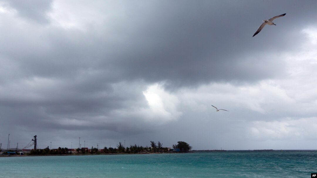 Skies darken as Hurricane Joaquin passes through the region, seen from Nassau, Bahamas, early Friday, Oct. 2, 2015.