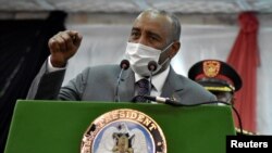 FILE - Sudan's Sovereign Council Chief General Abdel Fattah al-Burhan addresses delegates after signing a declaration of principles between Sudanese transitional government and the SPLM in Juba, South Sudan, March 28, 2021.