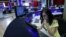 FILE - A journalist works at her desk in a newsroom of the Rustavi 2 TV station in Tbilisi, Georgia, Oct, 2, 2015.