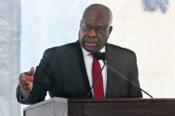 FILE - Supreme Court Justice Clarence Thomas delivers a speech in Atlanta, February 11, 2020.