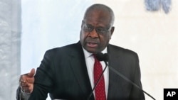 FILE - Supreme Court Justice Clarence Thomas delivers a speech in Atlanta, Feb. 11, 2020.