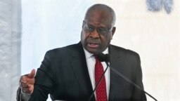 FILE - Supreme Court Justice Clarence Thomas delivers a speech in Atlanta, Feb. 11, 2020.