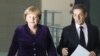 Меркель и Саркози требуют как можно скорее принять меры по борьбе с кризисом