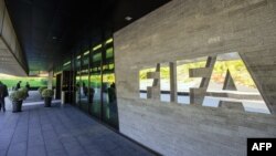 FILE - A FIFA (International Football Federation Association) sign is seen outside of the organization's headquarters in Zurich, Switzerland, Sept. 3, 2013.