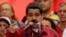 FILE - Venezuela's President Nicolas Maduro gives a speech at a rally against U.S President Donald Trump in Caracas, Venezuela, Aug. 14, 2017. 