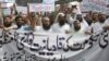 In this Sept. 7, 2018 file photo, Pakistani Islamists protest the appointment of a minority Ahmadi Muslim as an adviser to the government, in Lahore, Pakistan.