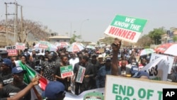 FILE - Supporters of Atiku Abubakar of the Peoples Democratic Party and second place candidate, attend a protest against the recent presidential election results, in Abuja , Nigeria, Monday, March 6, 2023. 