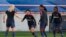 FILE - (L-R) PSG's Andrine Hegerberg, Shuang Wang, Grace Geyoro and Aminata Diallo warm up prior to their Women's Champions League soccer match between Paris-Saint-Germain and Sankt Polten at Jean Bouin stadium in Paris, France, Sept. 27, 2018. 