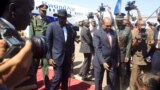 Sudan’s President Omar al-Bashir, right, welcomes South Sudan's President Salva Kiir at Khartoum airport, Sudan, Nov. 1, 2017.