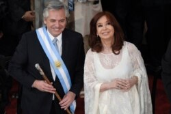 FILE - Argentina's new President Alberto Fernandez and Vice President Cristina Fernandez de Kirchner smile after they take the oath of office at the Congress in Buenos Aires, Argentina, Dec. 10, 2019.