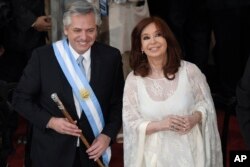 FILE - Argentina's new President Alberto Fernandez and Vice President Cristina Fernandez de Kirchner smile after they take the oath of office at the Congress in Buenos Aires, Argentina, Dec. 10, 2019.