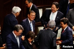 Reaksi Perdana Menteri Jepang Shigeru Ishiba setelah terpilih kembali sebagai perdana menteri, di Majelis Rendah Parlemen di Tokyo, Jepang, 11 November 2024. (Kim Kyung-Hoon/REUTERS)