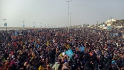 Supporters of the Balochistan Yakjehti Committee (BYC) listen to the speech of their leader during what they call the Baloch National Gathering in Gwadar, Pakistan July 28, 2024.