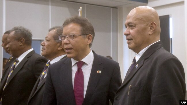 Tuvaluan Prime Minister Feleti Teo, right, looks on after a swearing-in ceremony in Funafuti, the capital of the South Pacific nation of Tuvalu, on Feb. 28, 2024.