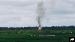 Fire and smoke raise after artillery shelling near Bakhmut, an eastern city where fierce battles between Ukrainian and Russian forces have been taking place, in the Donetsk region, Ukraine, April 29, 2023.