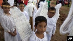 Children in Panama wait to participate in a pageant. 