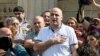 FILE - Opposition MP Nika Melia speaks to reporters outside the Tbilisi City Court, in Tbilisi, Georgia, June 27, 2019.