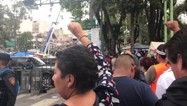 Rescue Workers Continue Searching for Suvivors in Damaged Building