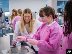 Students from Lewisville High School – Harmon Campus (Texas, U.S.A.) putting their knowledge to the test by creating their own Mary Kay® Unlimited Lip Gloss at Mary Kay's global Richard R. Rogers Manufacturing and Research & Development Center (Photo Credit: Mary Kay Inc. via AP)