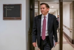 FILE - In this Oct. 4, 2019, photo, Michael Atkinson, the inspector general of the intelligence community, arrives at the Capitol in Washington for closed-door questioning about a whistleblower complaint.