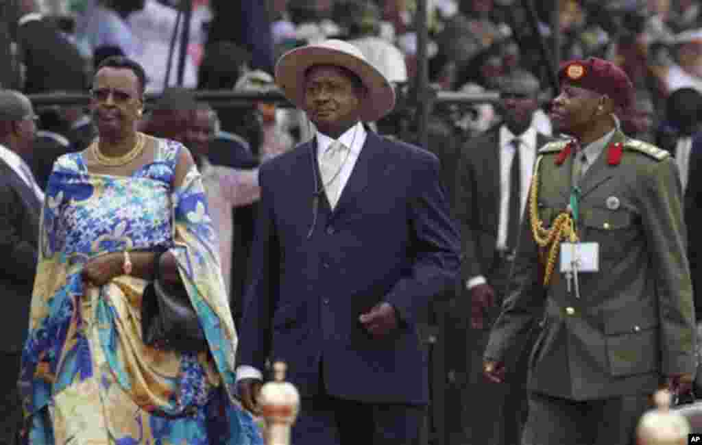 Ugandan President Yoweri Museveni, center, arrives for the inauguration ceremony of Nigeria President Goodluck Jonathan at the main parade ground in Nigeria's capital of Abuja, Sunday, May 29, 2011. Jonathan was sworn in Sunday for a full four-year term a