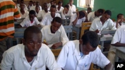 FILE - Somali students attend their annual exam in Yusuf Kowneyn secondary school in Mogadishu, Somalia.