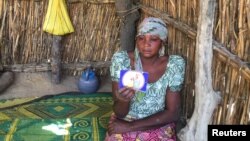 FILE - The mother of one of the abducted Dapchi girls is pictured in Dapchi, Yobe state, Nigeria, March 1, 2018. 