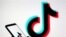 FILE—Person holds a smartphone with Tik Tok logo displayed in this picture illustration
