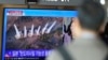 A TV screen shows a report of North Korea's multiple short-range ballistic missiles with file footage during a news program at the Seoul Railway Station in Seoul, South Korea, Nov. 5, 2024. 