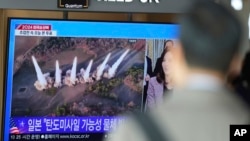 A TV screen shows a report of North Korea's multiple short-range ballistic missiles with file footage during a news program at the Seoul Railway Station in Seoul, South Korea, Nov. 5, 2024. 