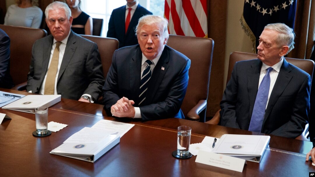 President Donald Trump speaks during a cabinet meeting at the White House as Secretary of State Rex Tillerson, left, and Secretary of Defense Jim Mattis, right, listen, Oct. 16, 2017.