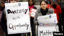 FILE – Demonstrators take part in a rally as the US Supreme Court hears the affirmative action in university admissions case in Washington, Dec. 9, 2015. 